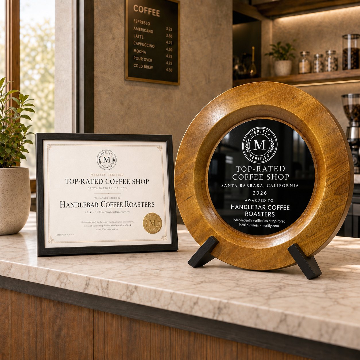 Meritly award plaque and framed certificate on a counter